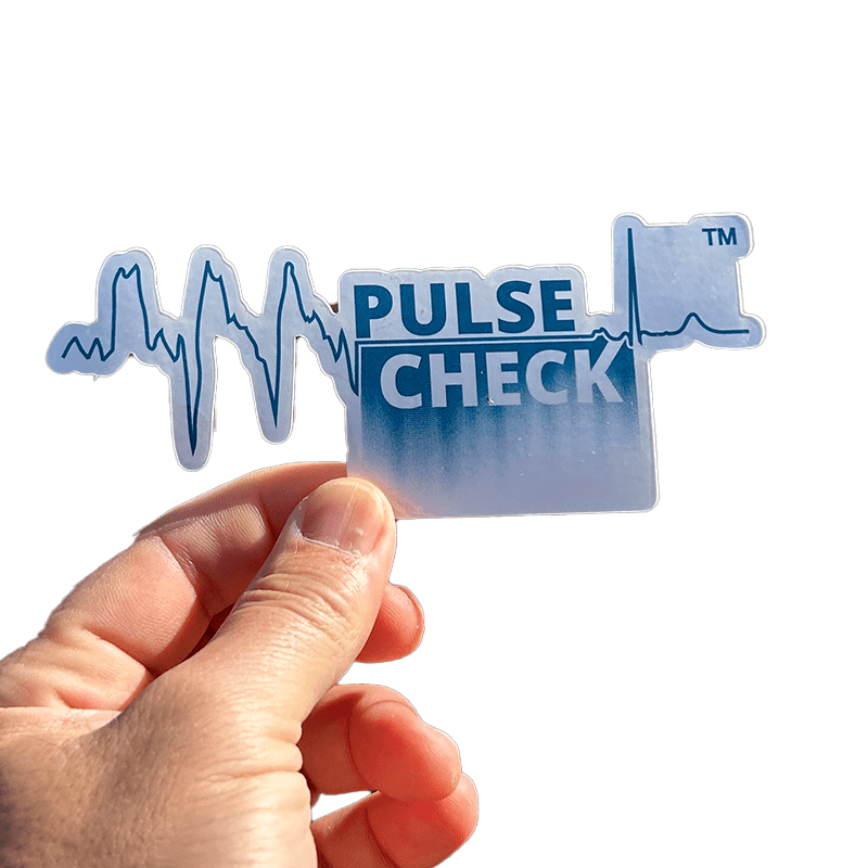 pulse check sticker held by thumb